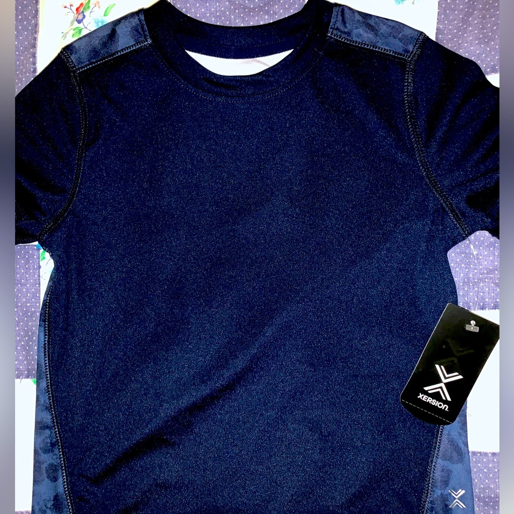 Boys Xersion Blue/Camo Quick Dri Shirt. Brand New, size XS 6/7. Add that layer!